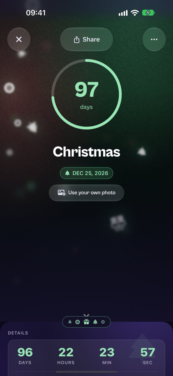 A Kounts Christmas countdown in its green theme, with snow drifting over the ring